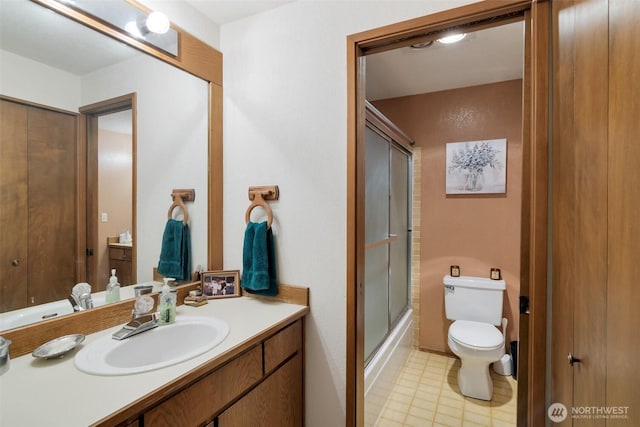 19524 Echo Lake Pl N Unit A-402, Shoreline, WA 98133 - bathroom with vanity, enclosed tub / shower combo, and tile patterned floors