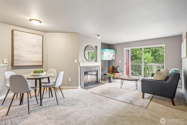 7711 NE 175th St Unit E110, Kenmore, WA 98028 - living area with carpet and a tile fireplace