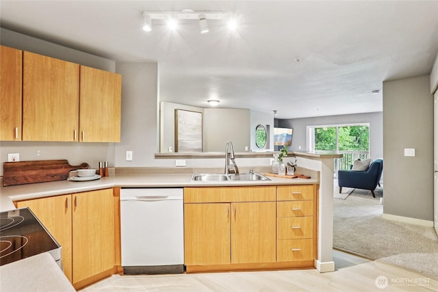 7711 NE 175th St Unit E110, Kenmore, WA 98028 - kitchen with white dishwasher, a peninsula, electric stove, light countertops, and open floor plan