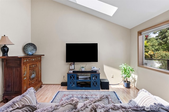 2815 60th Street Ct NW, Gig Harbor, WA 98335 - living room with a skylight, wood finished floors, and lofted ceiling