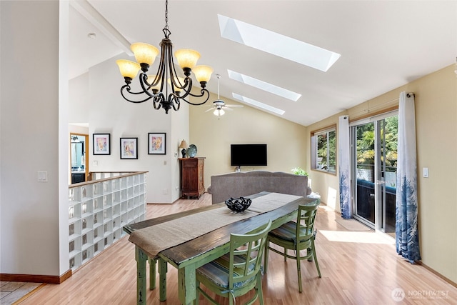 2815 60th Street Ct NW, Gig Harbor, WA 98335 - dining space with lofted ceiling, a chandelier, a skylight, and light wood-style flooring