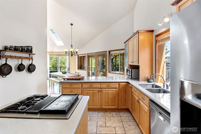 2815 60th Street Ct NW, Gig Harbor, WA 98335 - kitchen featuring appliances with stainless steel finishes, a chandelier, light countertops, high vaulted ceiling, and pendant lighting