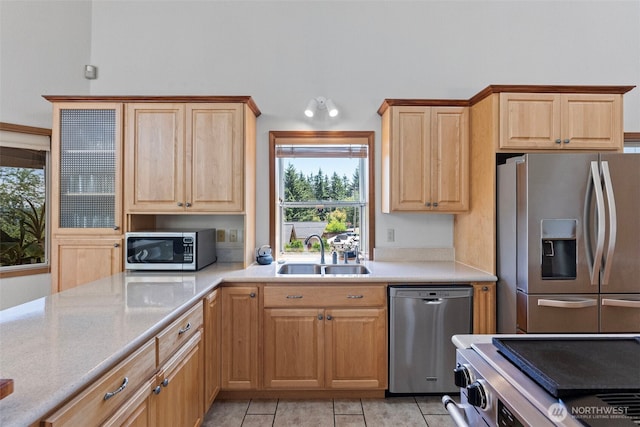 2815 60th Street Ct NW, Gig Harbor, WA 98335 - kitchen featuring stainless steel appliances, light tile patterned floors, and light brown cabinetry