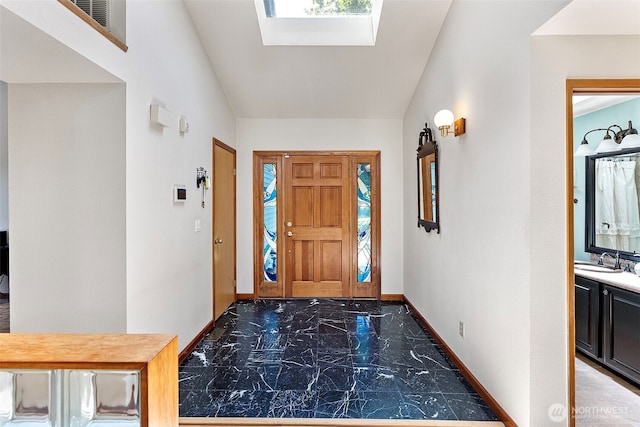 2815 60th Street Ct NW, Gig Harbor, WA 98335 - entrance foyer with marble finish flooring and a skylight