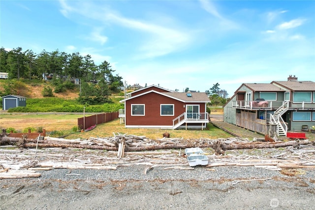 451 Beach Dr, Sequim, WA 98382 - view of front facade featuring a storage unit and stairs