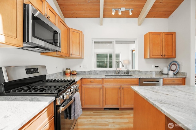 451 Beach Dr, Sequim, WA 98382 - kitchen with appliances with stainless steel finishes, wooden ceiling, light wood finished floors, and light stone counters