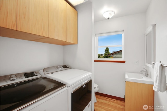 451 Beach Dr, Sequim, WA 98382 - laundry area featuring washer and clothes dryer and light wood finished floors