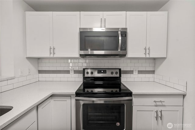 975 Aberdeen Ave NE Unit C306, Renton, WA 98056 - kitchen with appliances with stainless steel finishes, white cabinetry, and light countertops