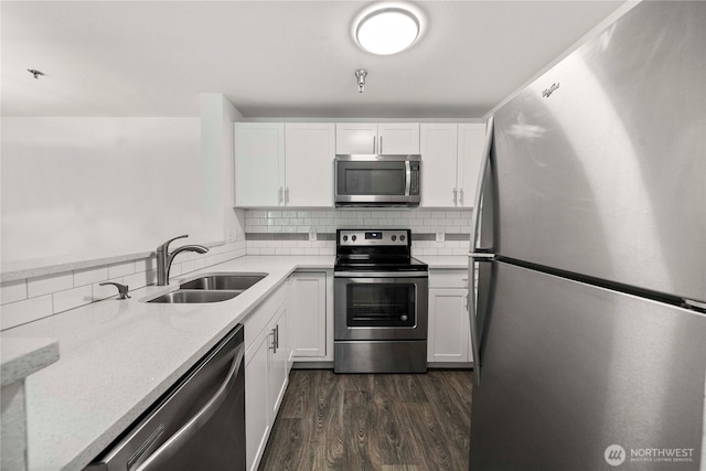 975 Aberdeen Ave NE Unit C306, Renton, WA 98056 - kitchen with appliances with stainless steel finishes, decorative backsplash, and white cabinetry