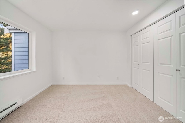 975 Aberdeen Ave NE Unit C306, Renton, WA 98056 - unfurnished bedroom with baseboard heating, light colored carpet, recessed lighting, and a closet