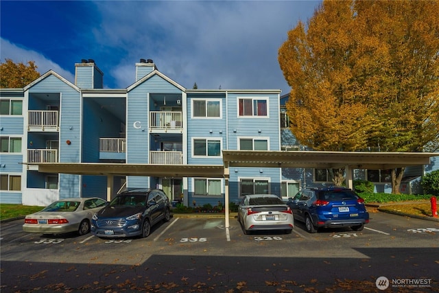 975 Aberdeen Ave NE Unit C306, Renton, WA 98056 - view of property featuring covered parking