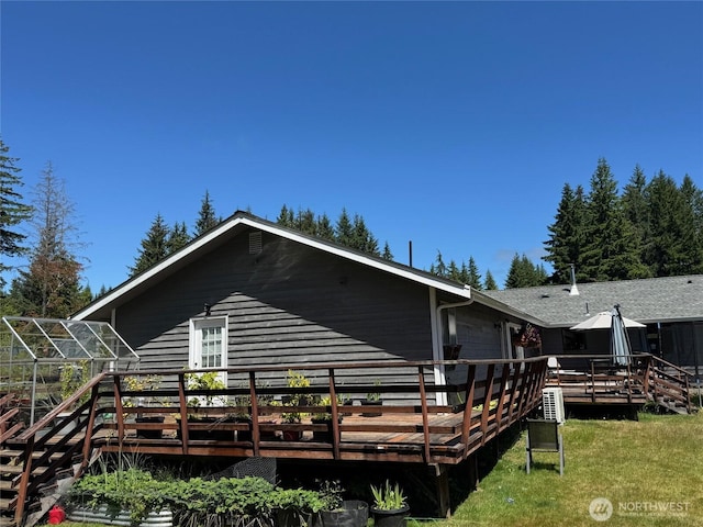 750 Chuckhole Way, Forks, WA 98331 - back of property featuring a deck, a yard, and an exterior structure