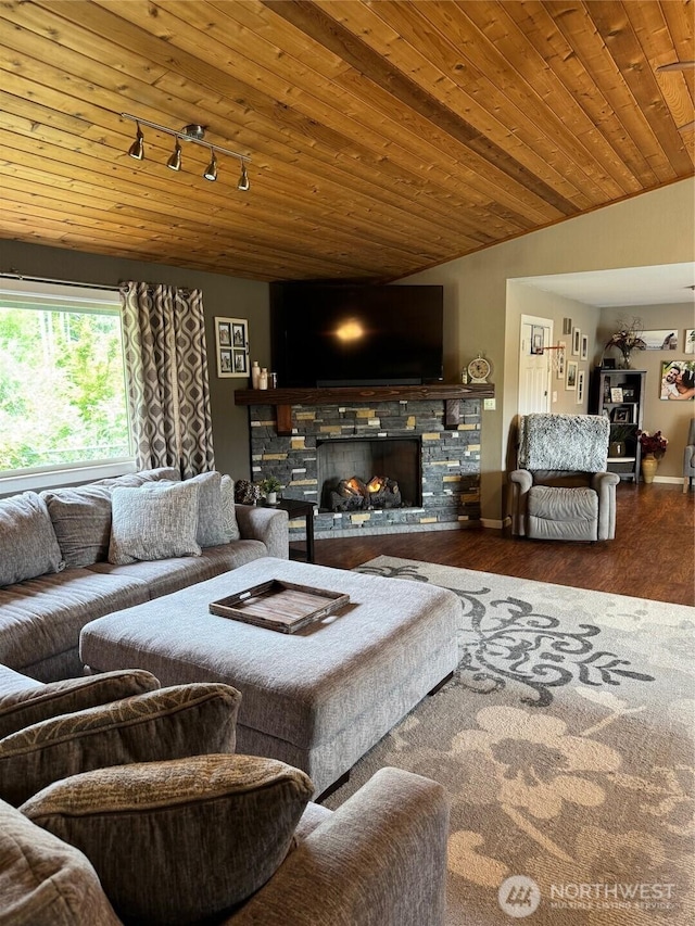 750 Chuckhole Way, Forks, WA 98331 - living room with a stone fireplace, wooden ceiling, wood finished floors, track lighting, and lofted ceiling