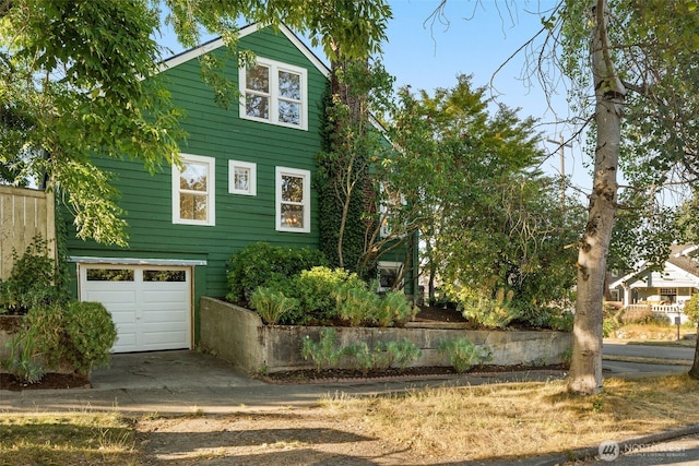 5803 Latona Ave NE, Seattle, WA 98105 - view of front facade with an attached garage and driveway
