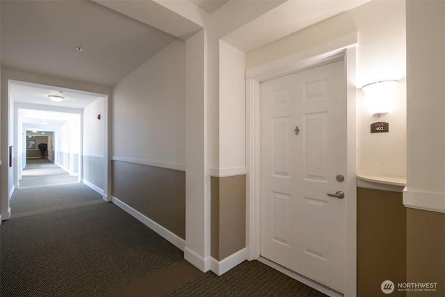 13301 SE 79th Pl Unit B-402, Newcastle, WA 98059 - hallway with dark carpet and baseboards