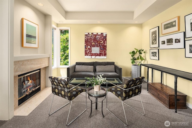 5115 NE Latimer Pl, Seattle, WA 98105 - carpeted living area featuring a premium fireplace, recessed lighting, and a tray ceiling