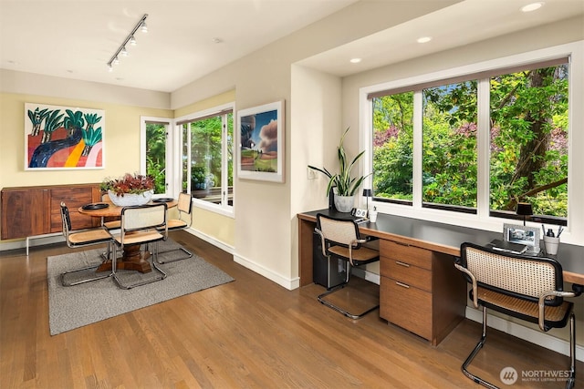 5115 NE Latimer Pl, Seattle, WA 98105 - dining room with rail lighting, wood finished floors, built in desk, and recessed lighting