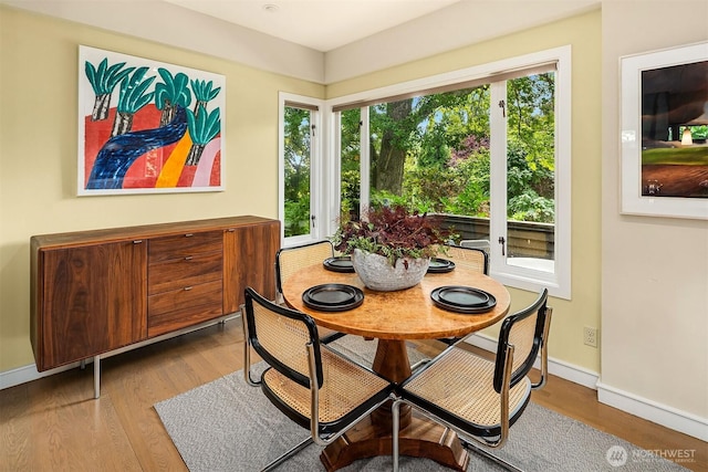5115 NE Latimer Pl, Seattle, WA 98105 - dining space with baseboards and wood finished floors