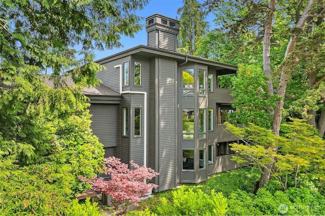 5115 NE Latimer Pl, Seattle, WA 98105 - view of side of home with a chimney