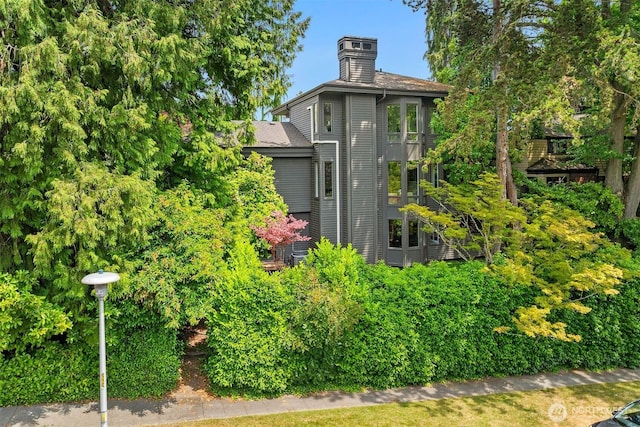 5115 NE Latimer Pl, Seattle, WA 98105 - view of property exterior featuring a chimney