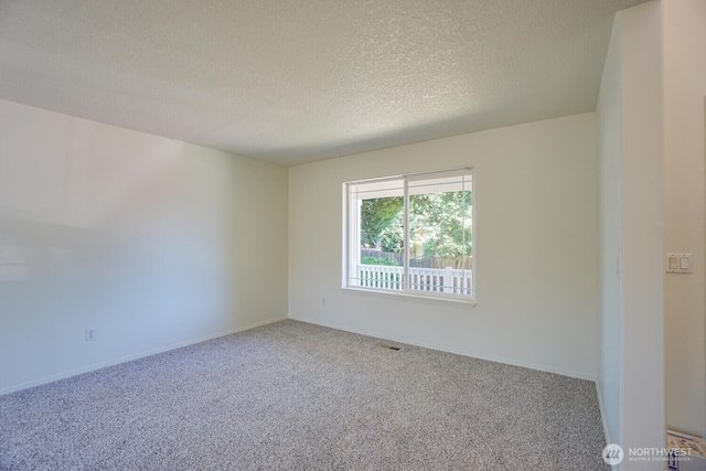 3300 NE 90th Cir, Vancouver, WA 98665 - carpeted spare room with a textured ceiling and baseboards