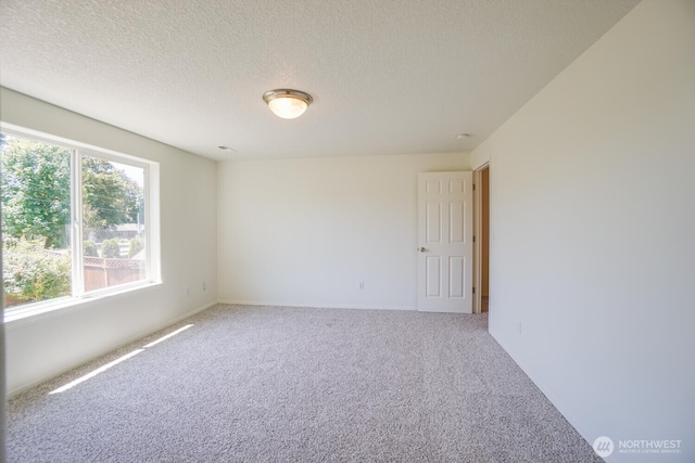 3300 NE 90th Cir, Vancouver, WA 98665 - carpeted spare room with a textured ceiling and baseboards