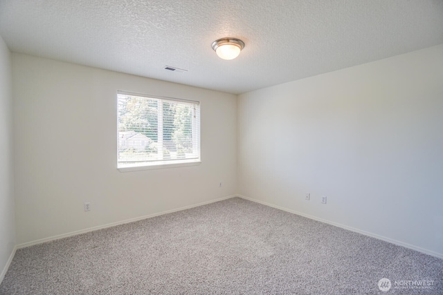 3300 NE 90th Cir, Vancouver, WA 98665 - carpeted empty room featuring a textured ceiling and baseboards