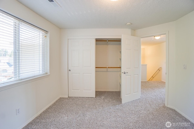 3300 NE 90th Cir, Vancouver, WA 98665 - unfurnished bedroom featuring carpet floors, a closet, and a textured ceiling