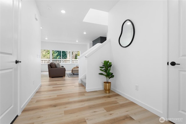 4710 Sagebrush Ln, Blaine, WA 98230 - hall with a skylight, stairway, recessed lighting, and wood finished floors