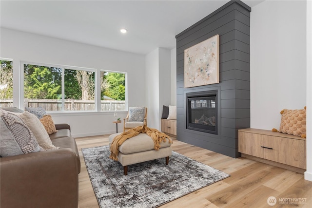 4710 Sagebrush Ln, Blaine, WA 98230 - living room with light wood-type flooring, a glass covered fireplace, and recessed lighting
