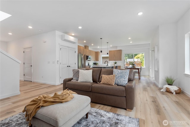 4710 Sagebrush Ln, Blaine, WA 98230 - living area with light wood finished floors, recessed lighting, and a wall unit AC