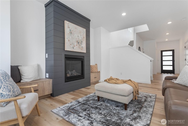 4710 Sagebrush Ln, Blaine, WA 98230 - living area with light wood-type flooring, stairway, a fireplace, and recessed lighting