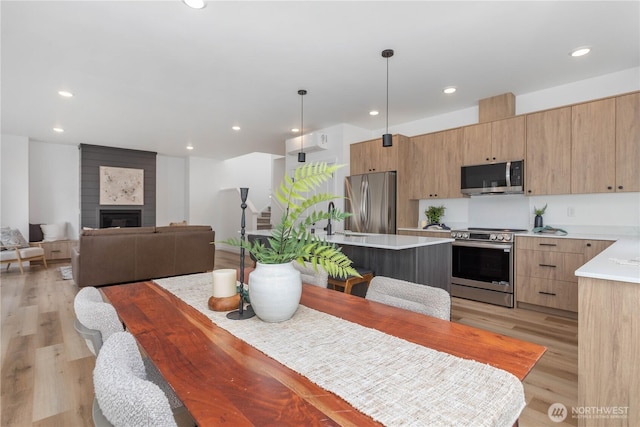 4710 Sagebrush Ln, Blaine, WA 98230 - dining area featuring light wood finished floors, recessed lighting, and a fireplace