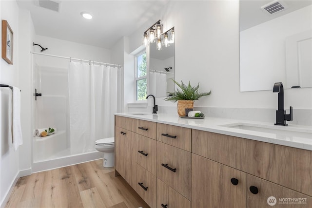 4710 Sagebrush Ln, Blaine, WA 98230 - full bath with double vanity, wood finished floors, and curtained shower