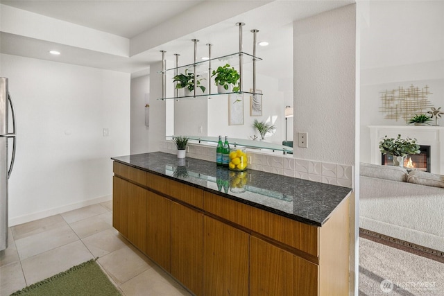 701 122nd Ave NE Unit 207, Bellevue, WA 98005 - bar with light tile patterned floors, freestanding refrigerator, and recessed lighting
