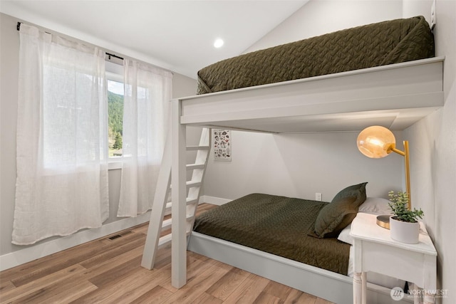 135 Main St E, Packwood, WA 98361 - bedroom with wood finished floors, recessed lighting, and lofted ceiling
