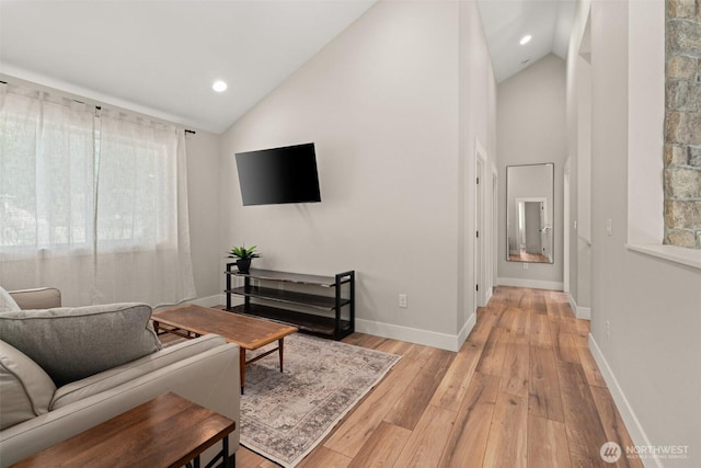 135 Main St E, Packwood, WA 98361 - living room featuring light wood-type flooring, high vaulted ceiling, and recessed lighting