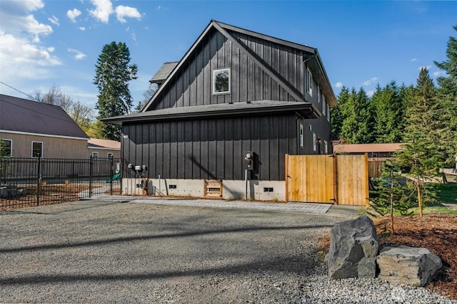 135 Main St E, Packwood, WA 98361 - view of side of property featuring board and batten siding, a gate, and crawl space