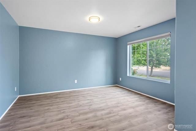 14933 Terra View St SE, Yelm, WA 98597 - empty room featuring wood finished floors and baseboards