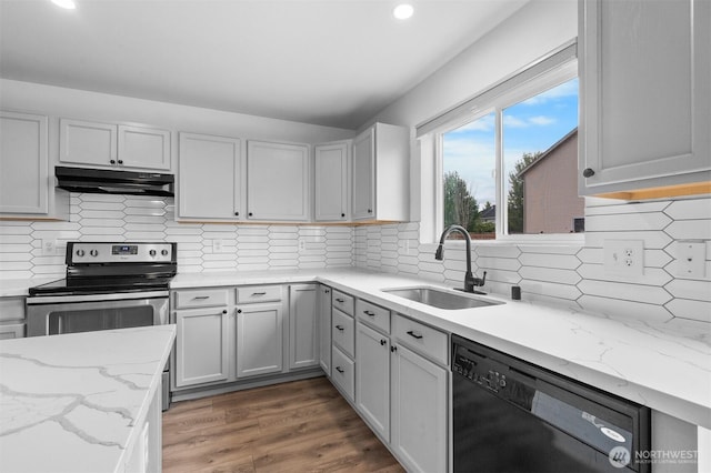 14933 Terra View St SE, Yelm, WA 98597 - kitchen with black dishwasher, under cabinet range hood, electric stove, recessed lighting, and wood finished floors