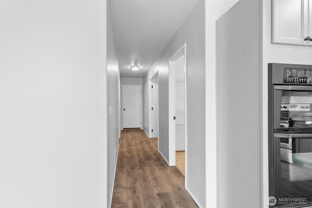 14933 Terra View St SE, Yelm, WA 98597 - corridor featuring wood finished floors and baseboards