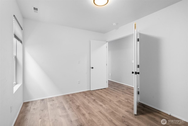 14933 Terra View St SE, Yelm, WA 98597 - unfurnished bedroom with wood finished floors and multiple windows