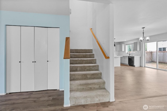 14933 Terra View St SE, Yelm, WA 98597 - staircase with wood finished floors and a chandelier