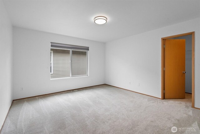 14933 Terra View St SE, Yelm, WA 98597 - unfurnished room featuring carpet flooring and baseboards