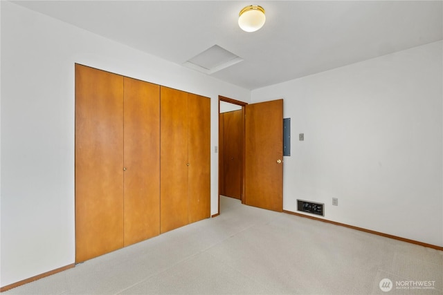 18910 Bothell Everett Hwy Unit K3, Bothell, WA 98012 - unfurnished bedroom with attic access, a closet, and light colored carpet