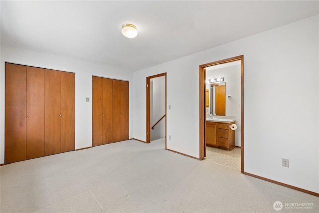 18910 Bothell Everett Hwy Unit K3, Bothell, WA 98012 - unfurnished bedroom with two closets, light colored carpet, and ensuite bathroom