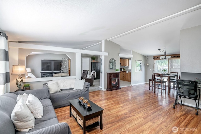 16420 SE 269th St SE, Covington, WA 98042 - living room featuring vaulted ceiling and light wood-style flooring