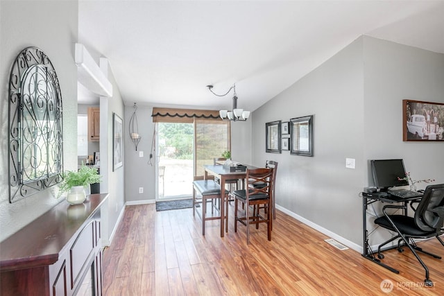 16420 SE 269th St SE, Covington, WA 98042 - dining space featuring light wood-type flooring, a chandelier, and vaulted ceiling