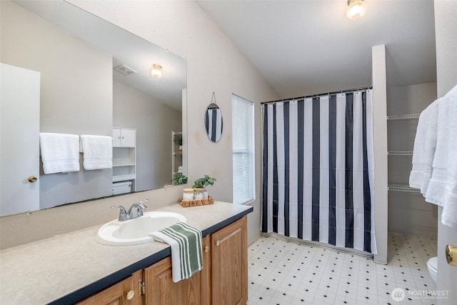 16420 SE 269th St SE, Covington, WA 98042 - full bath featuring vanity, lofted ceiling, tile patterned floors, and curtained shower
