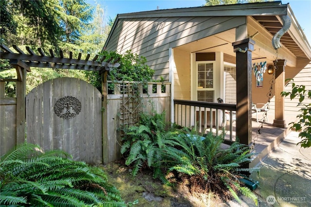 7829 197th Ave E, Bonney Lake, WA 98391 - view of side of home featuring a gate and a porch